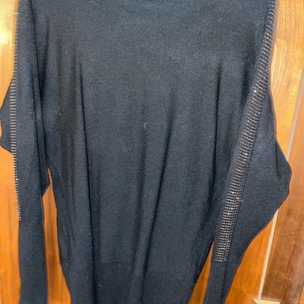 Black sweater with silver embellishments on sleeves. Large